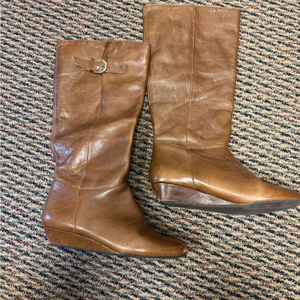 Steve Madden wedged knee-high boots.